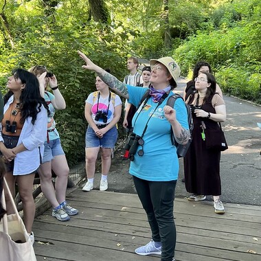 Bird guide Martha Harbison leads a group for the annual Let's Go Birding Together outing in Central Park in 2022