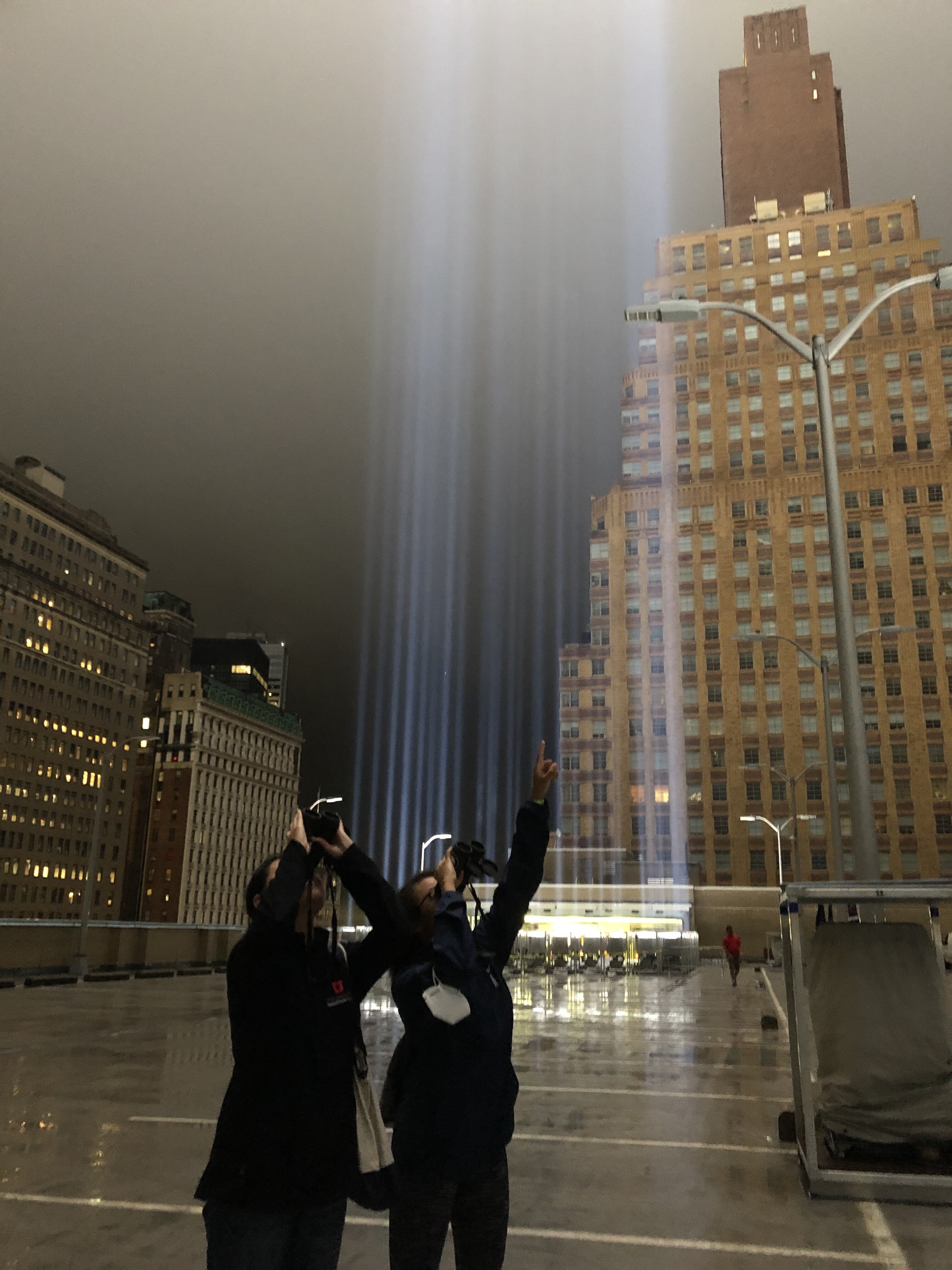 Community Science Manager Katherine Chen and Public Programs Manager Roslyn Rivas monitor the Tribute in Light for birds caught in the lights. Photo: NYC Audubon